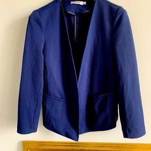 Navy blazer with waffle weave texture.